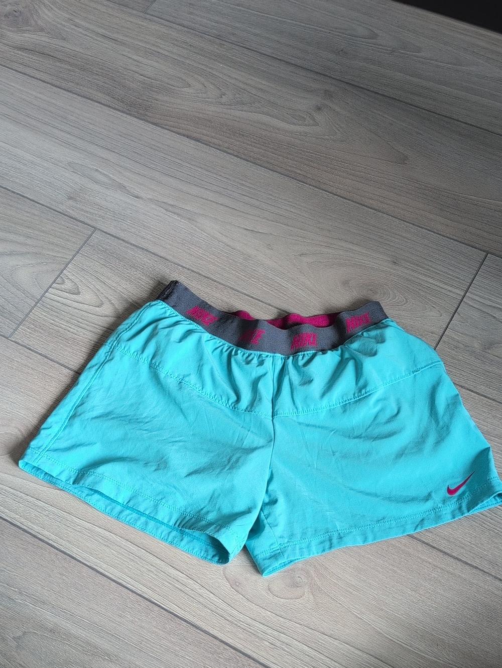Nike Women’s Turquoise Athletic Shorts with Pink Trim